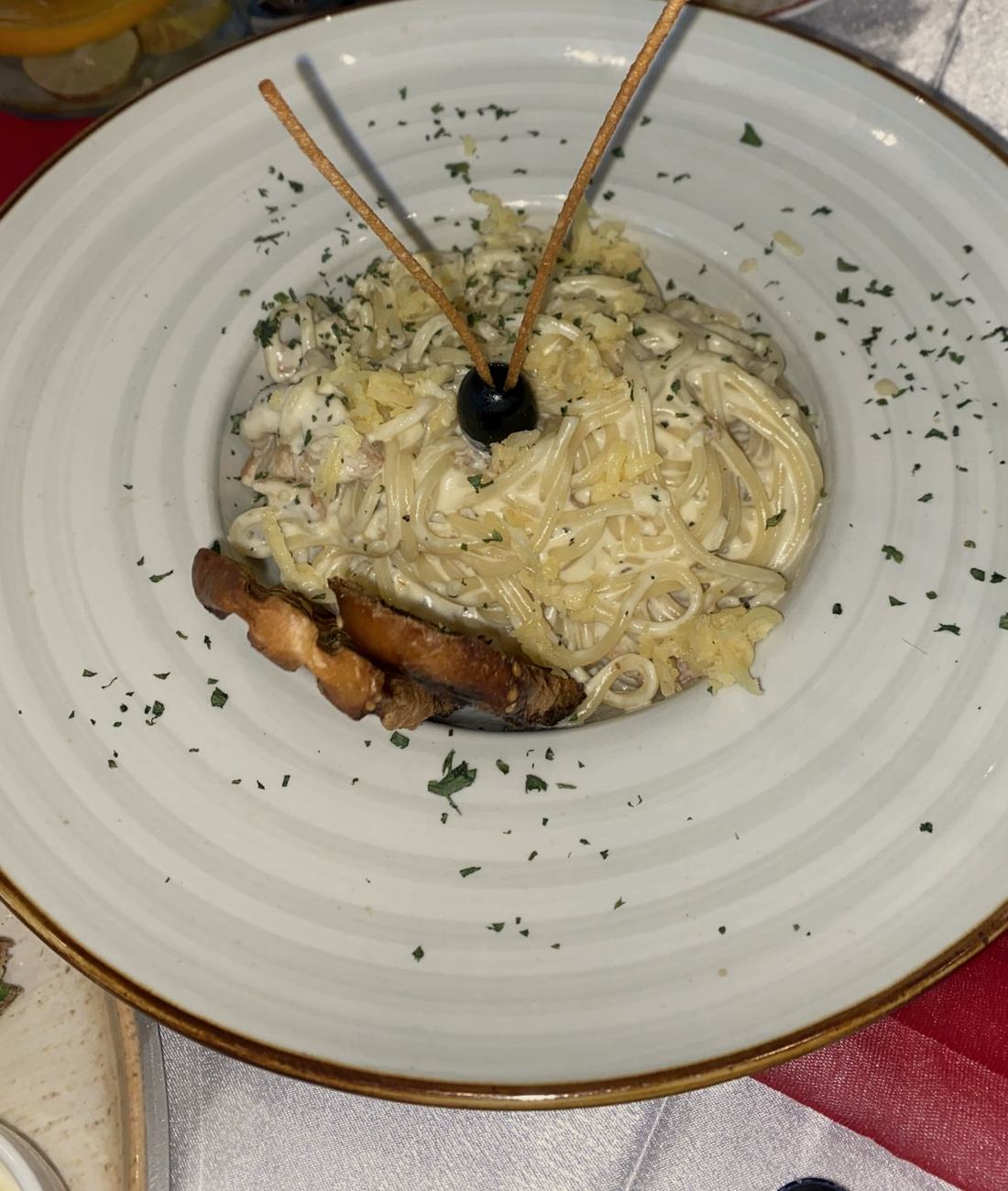 Tagliolini: egg-yolk pasta · aged parmesan · black olive