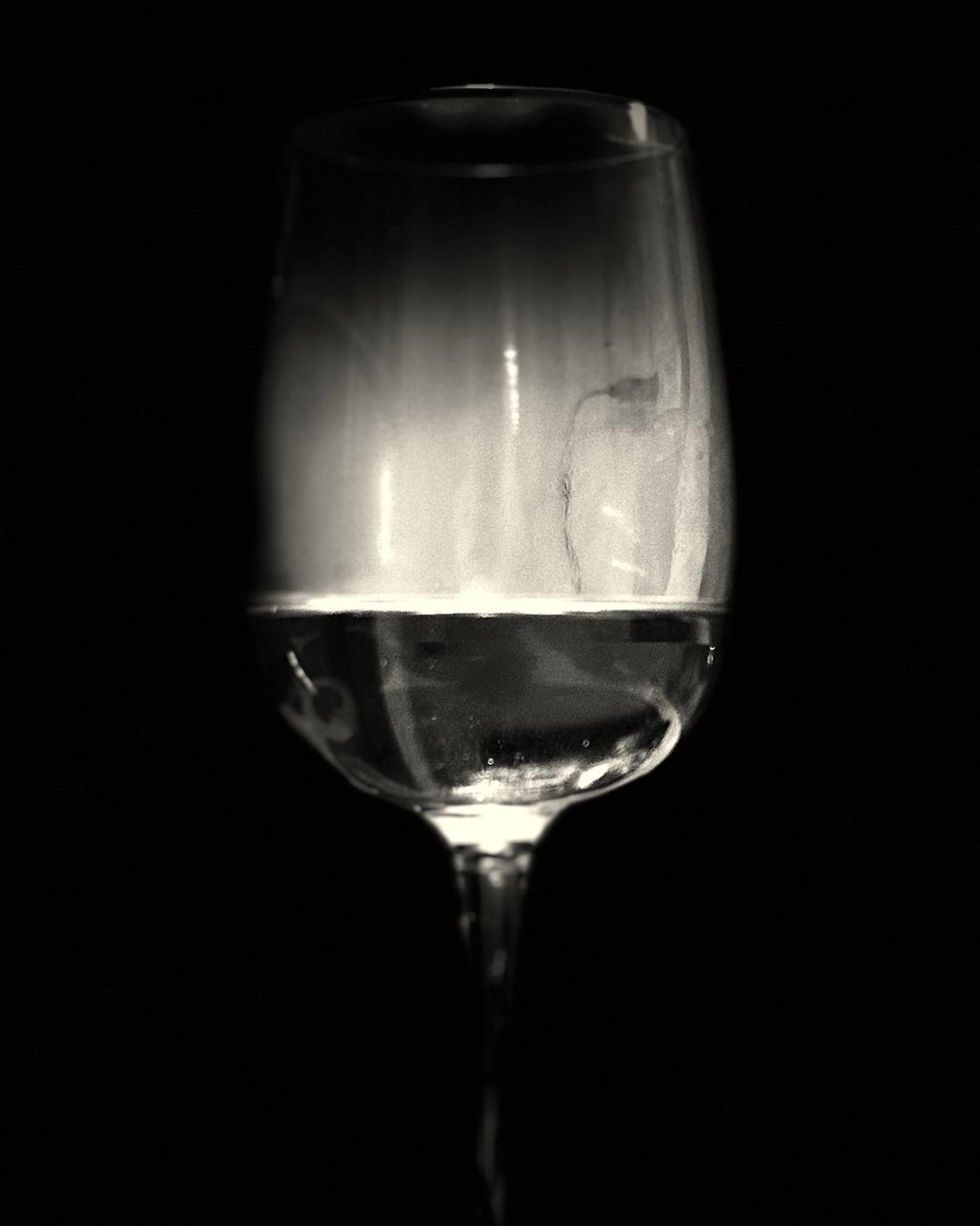 A glass of wine poured at the table