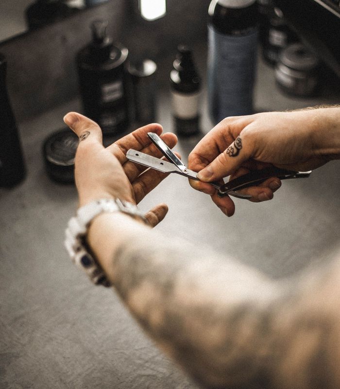 Scissors and comb at work on a short cut