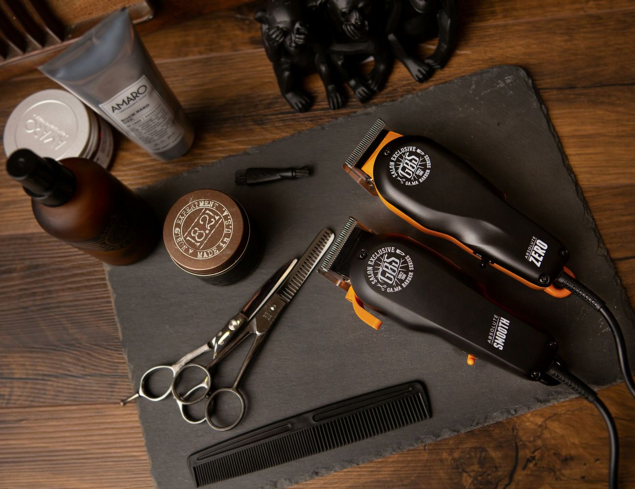 Clippers, scissors and combs laid out on the counter