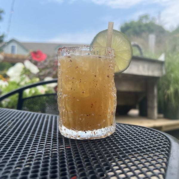 A mezcal margarita with a chilli salt rim