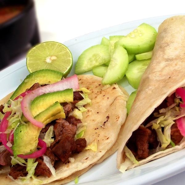 Cochinita tacos with avocado and pickled onion