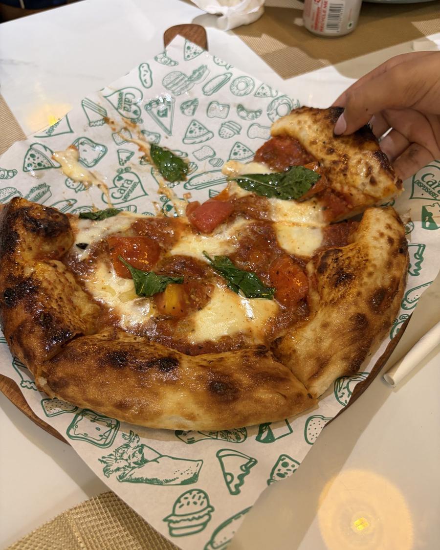 A blistered margherita with basil
