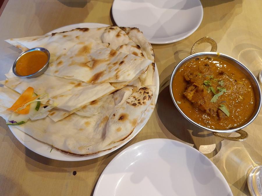 Naan and curry on the table